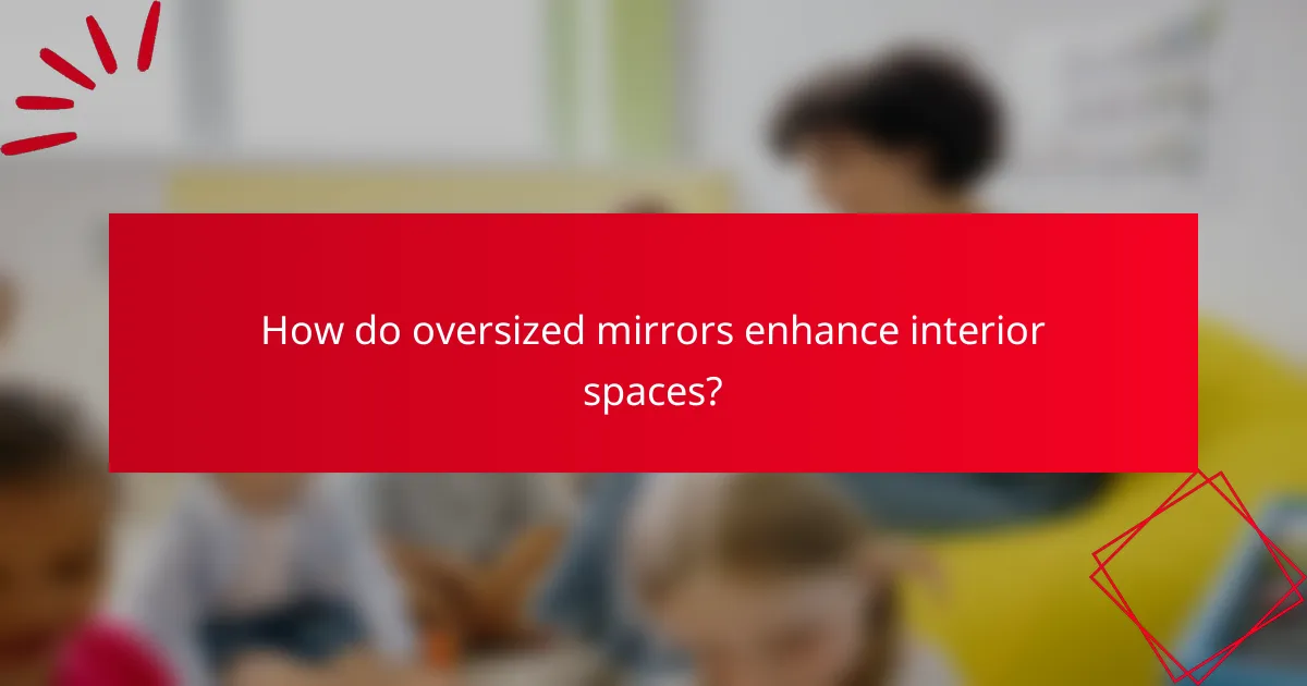 How do oversized mirrors enhance interior spaces?
